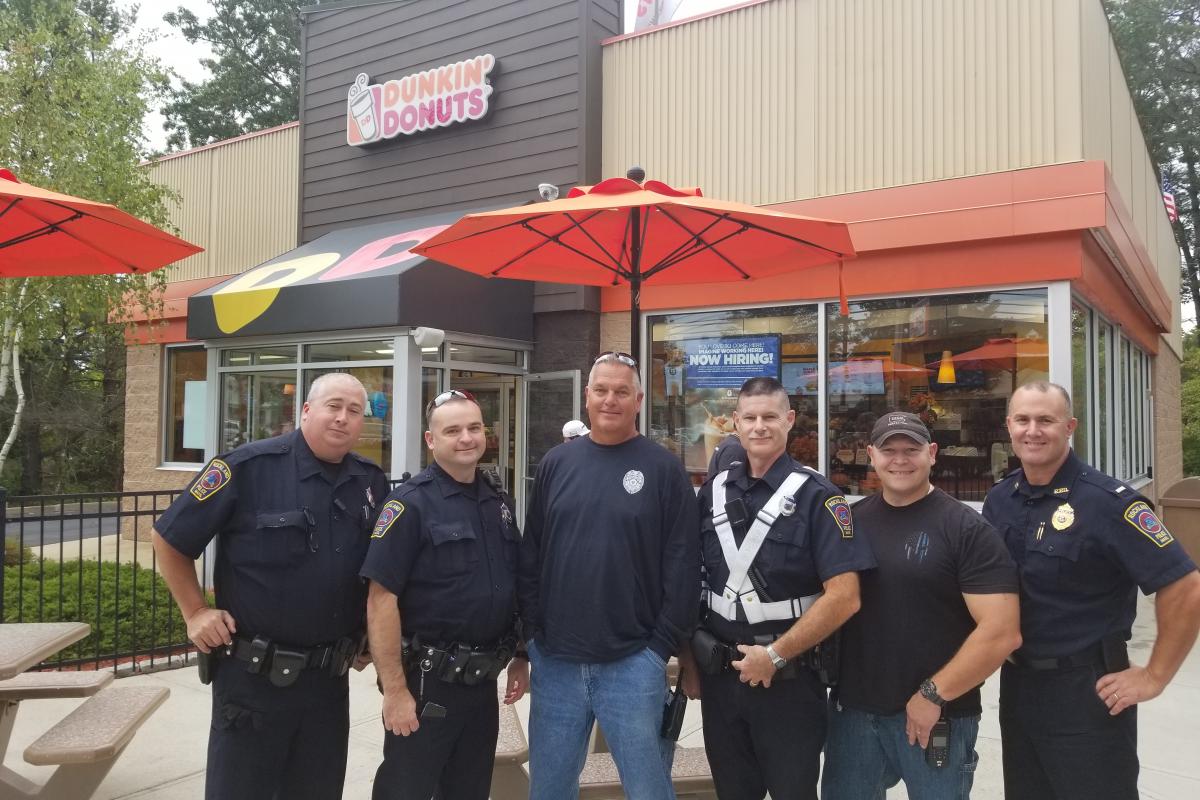 Five officers at Dunkin Donuts for Coffee with Cops